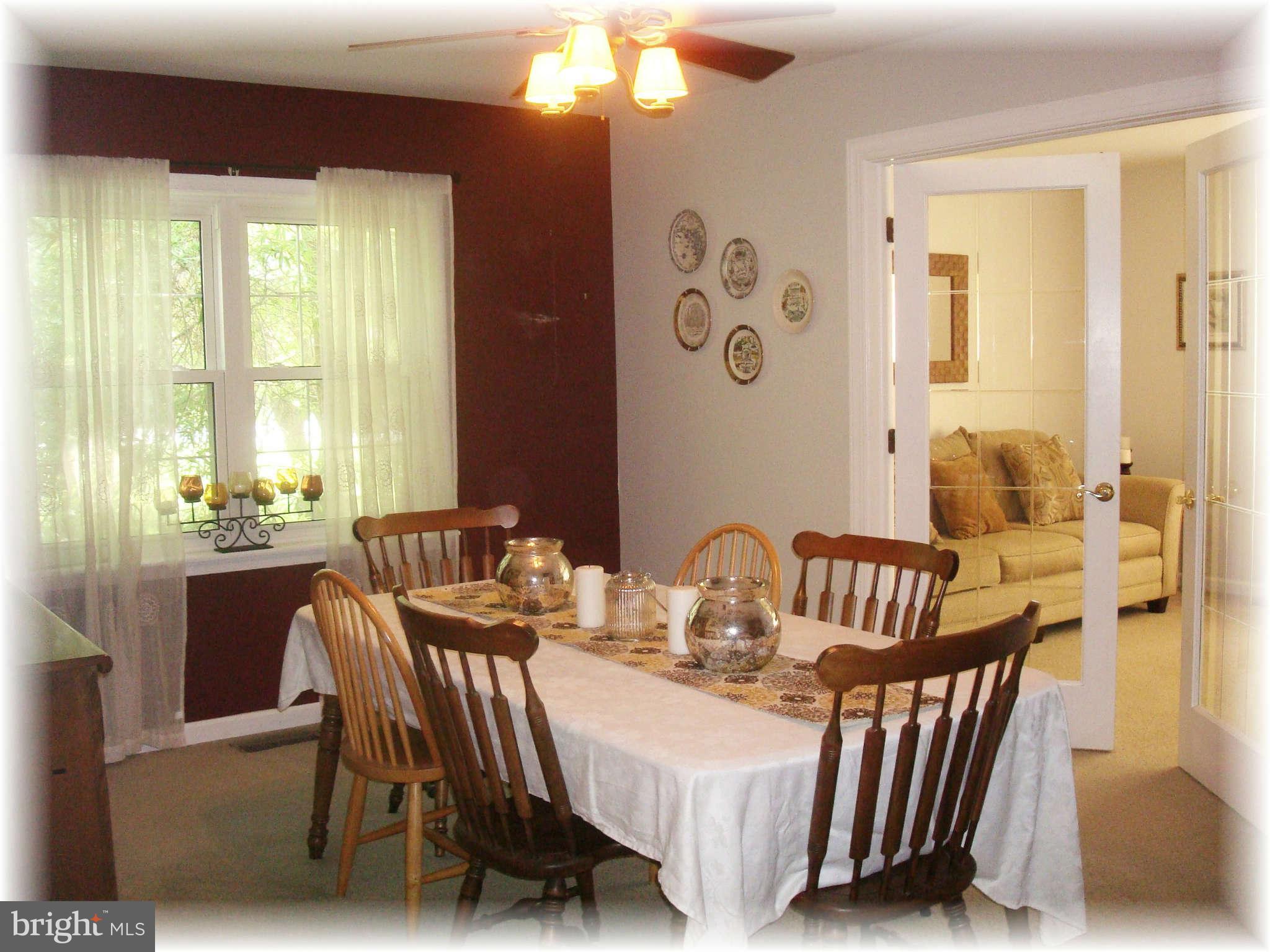 301 Bowleys Quarters Road Baltimore, MD 21220 - Photo 12 of 30 a view of a dining room with furniture window and outside view