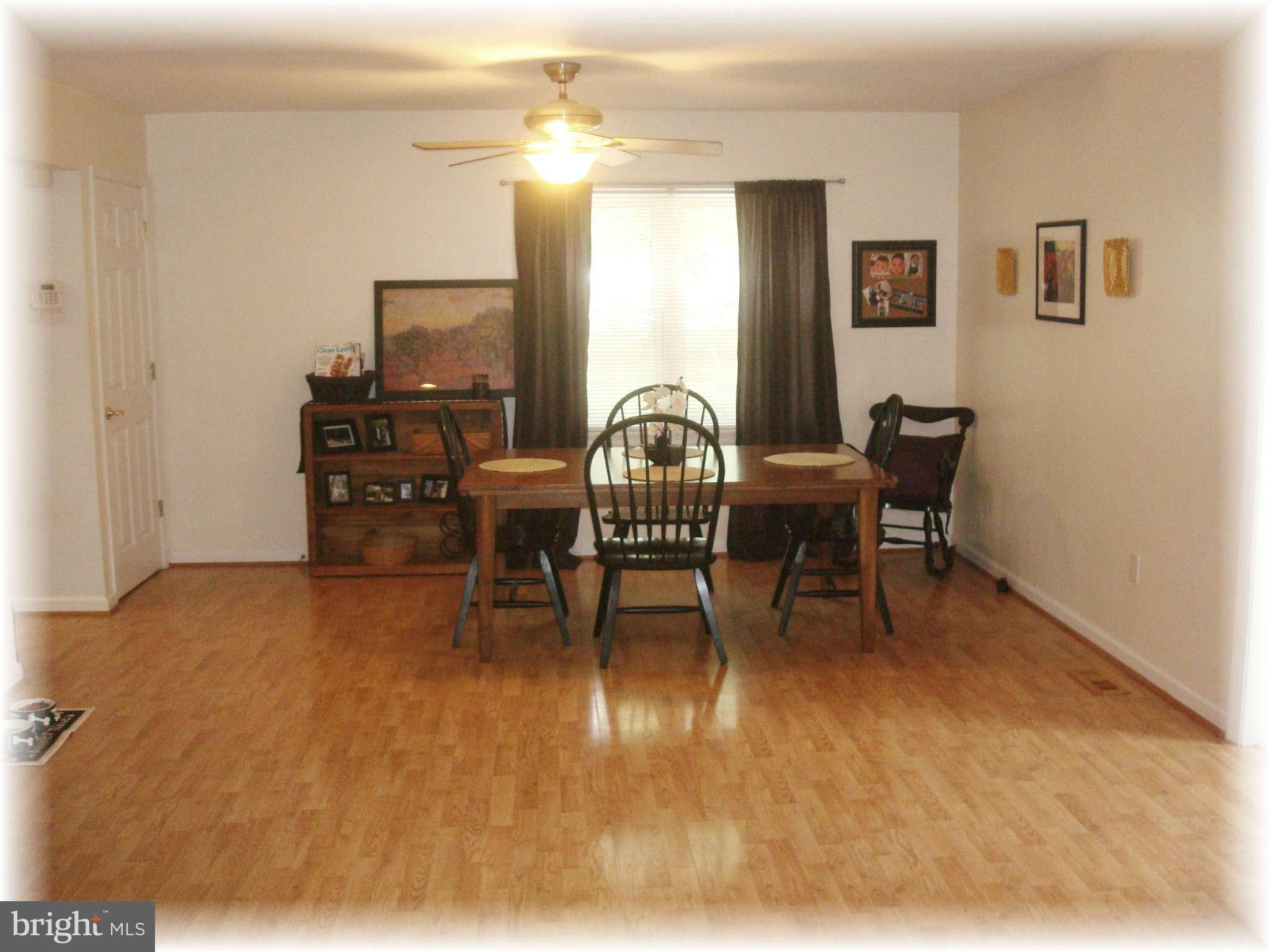 301 Bowleys Quarters Road Baltimore, MD 21220 - Photo 14 of 30 a workspace with furniture window and wooden floor