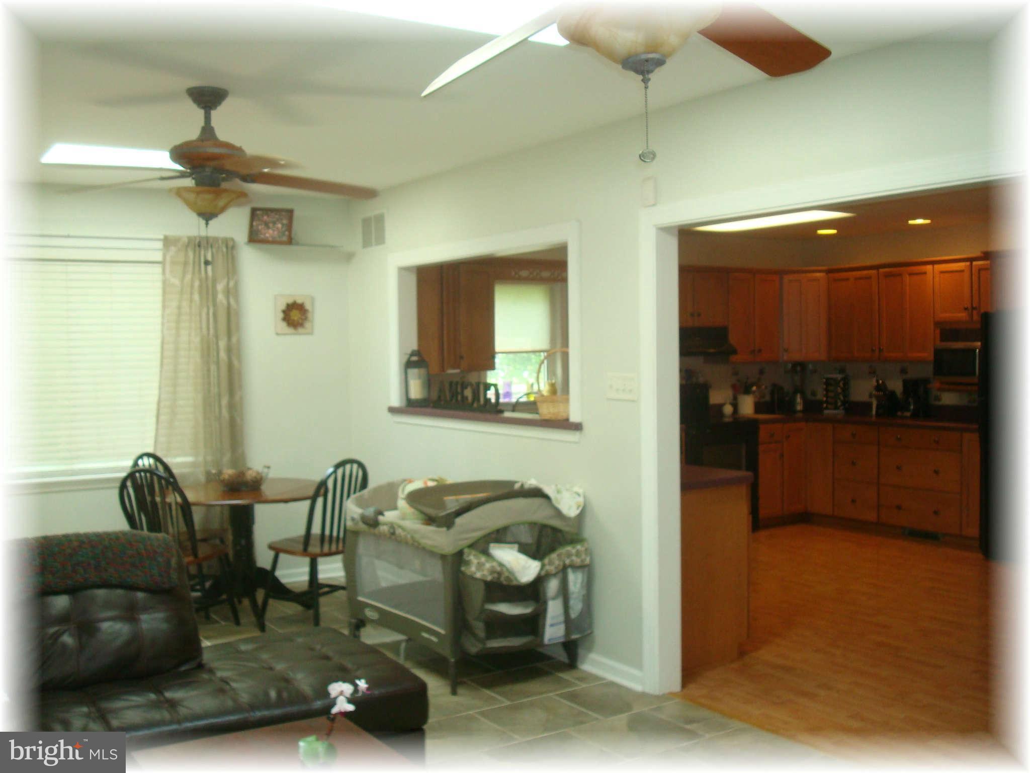 301 Bowleys Quarters Road Baltimore, MD 21220 - Photo 16 of 30 a dining room with furniture and a view of bathroom