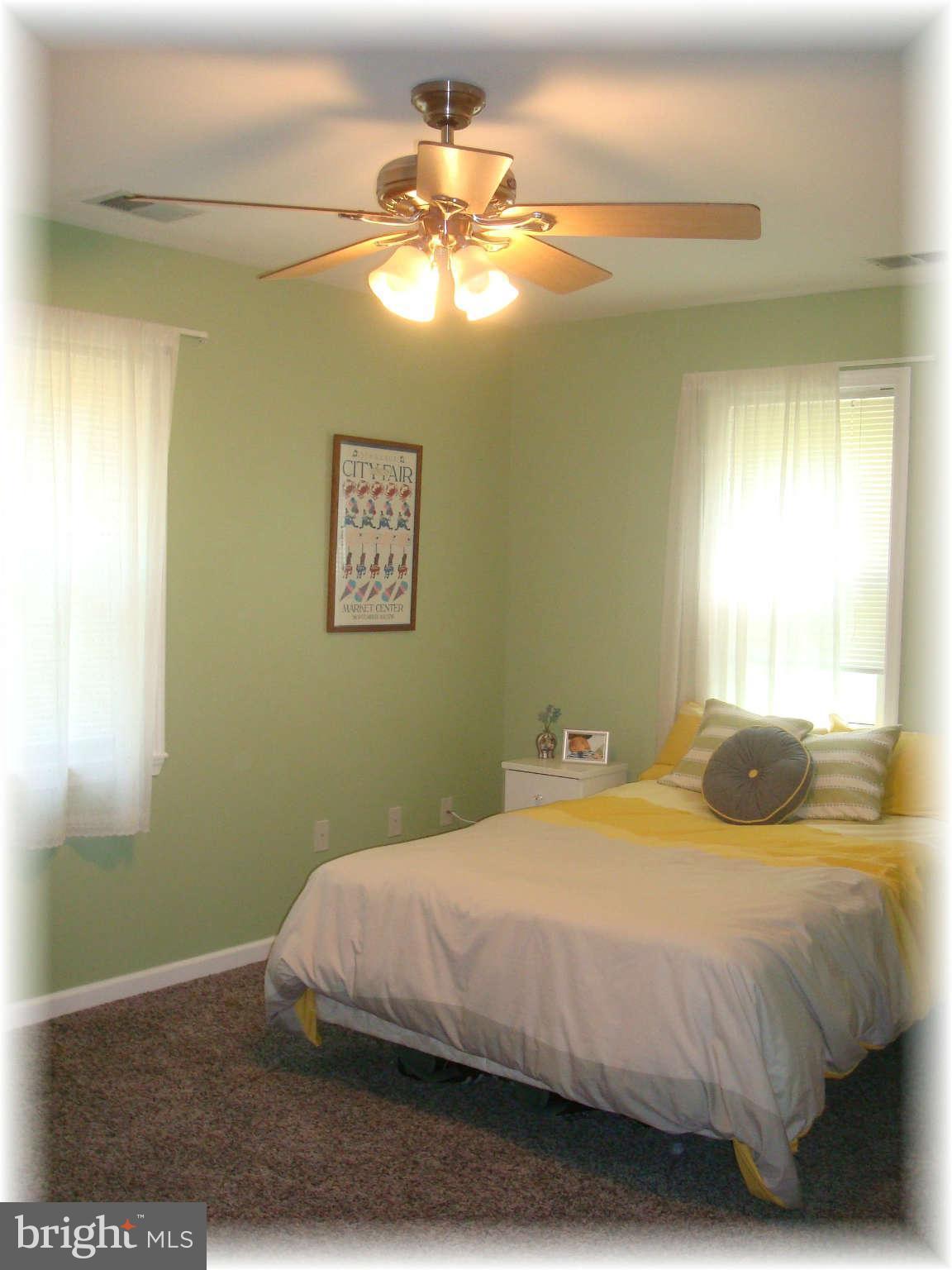 301 Bowleys Quarters Road Baltimore, MD 21220 - Photo 27 of 30 a bedroom with a bed and a chandelier