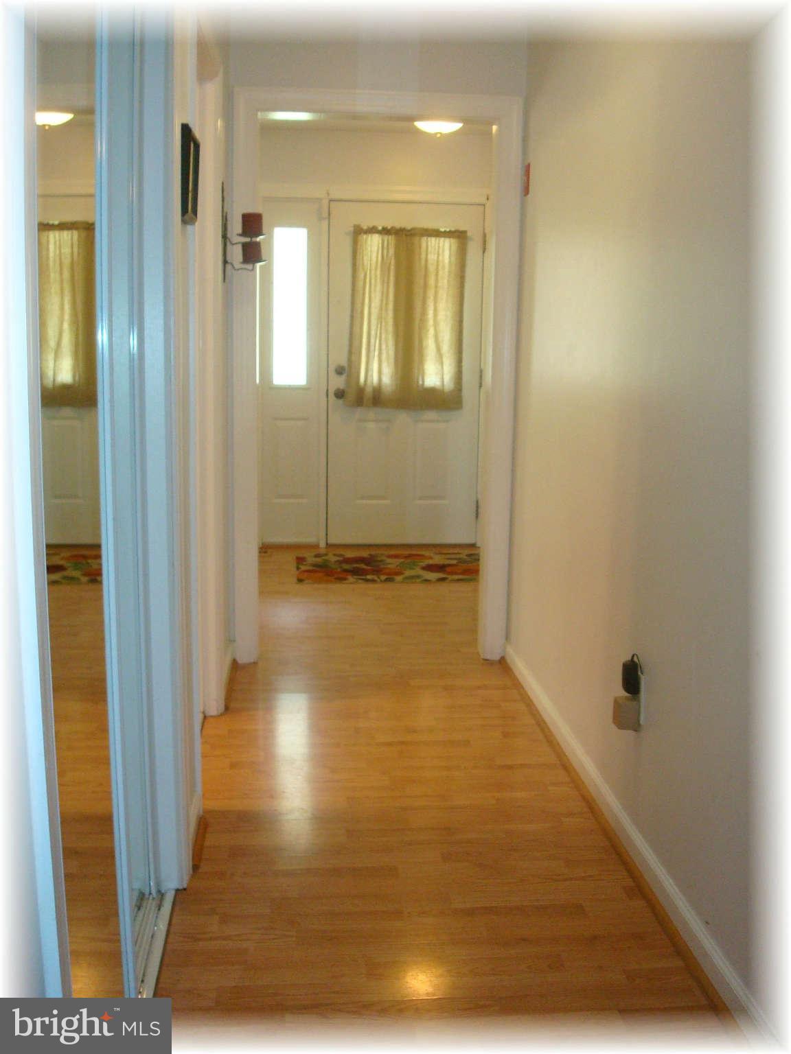 301 Bowleys Quarters Road Baltimore, MD 21220 - Photo 7 of 30 a view of a hallway with wooden floor