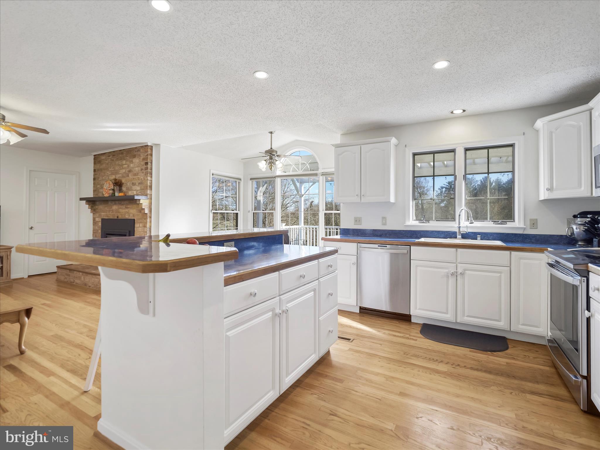 6527 Morningside Court Middletown, MD 21769 - Photo 19 of 42 a kitchen with granite countertop a sink cabinets and stainless steel appliances