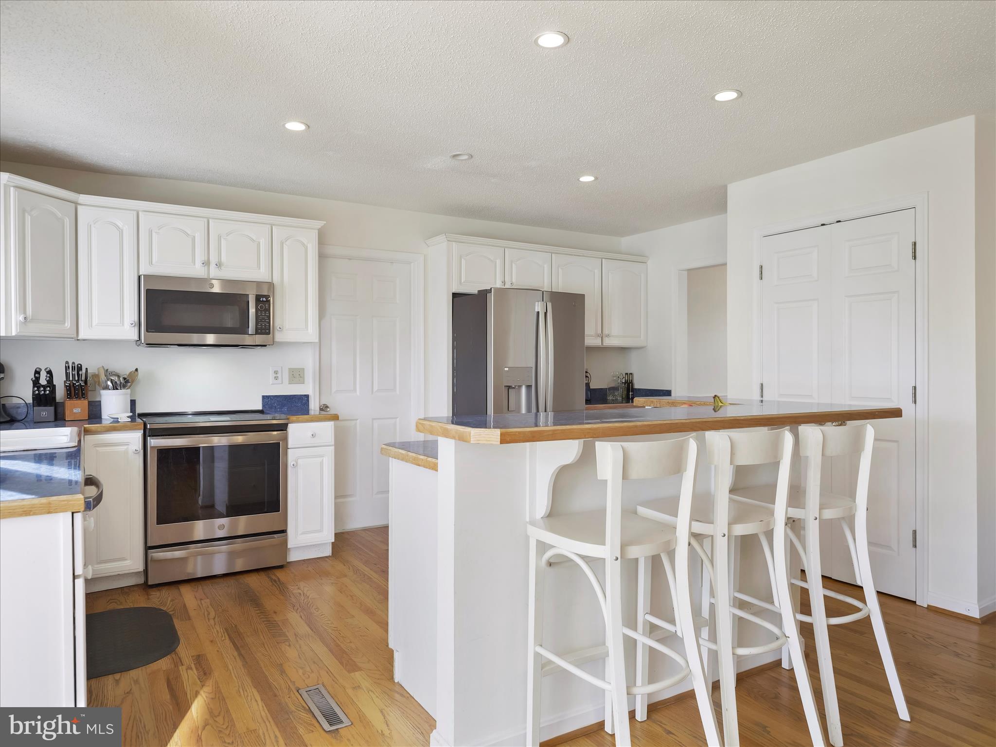 6527 Morningside Court Middletown, MD 21769 - Photo 21 of 42 a kitchen with wooden cabinets and stainless steel appliances