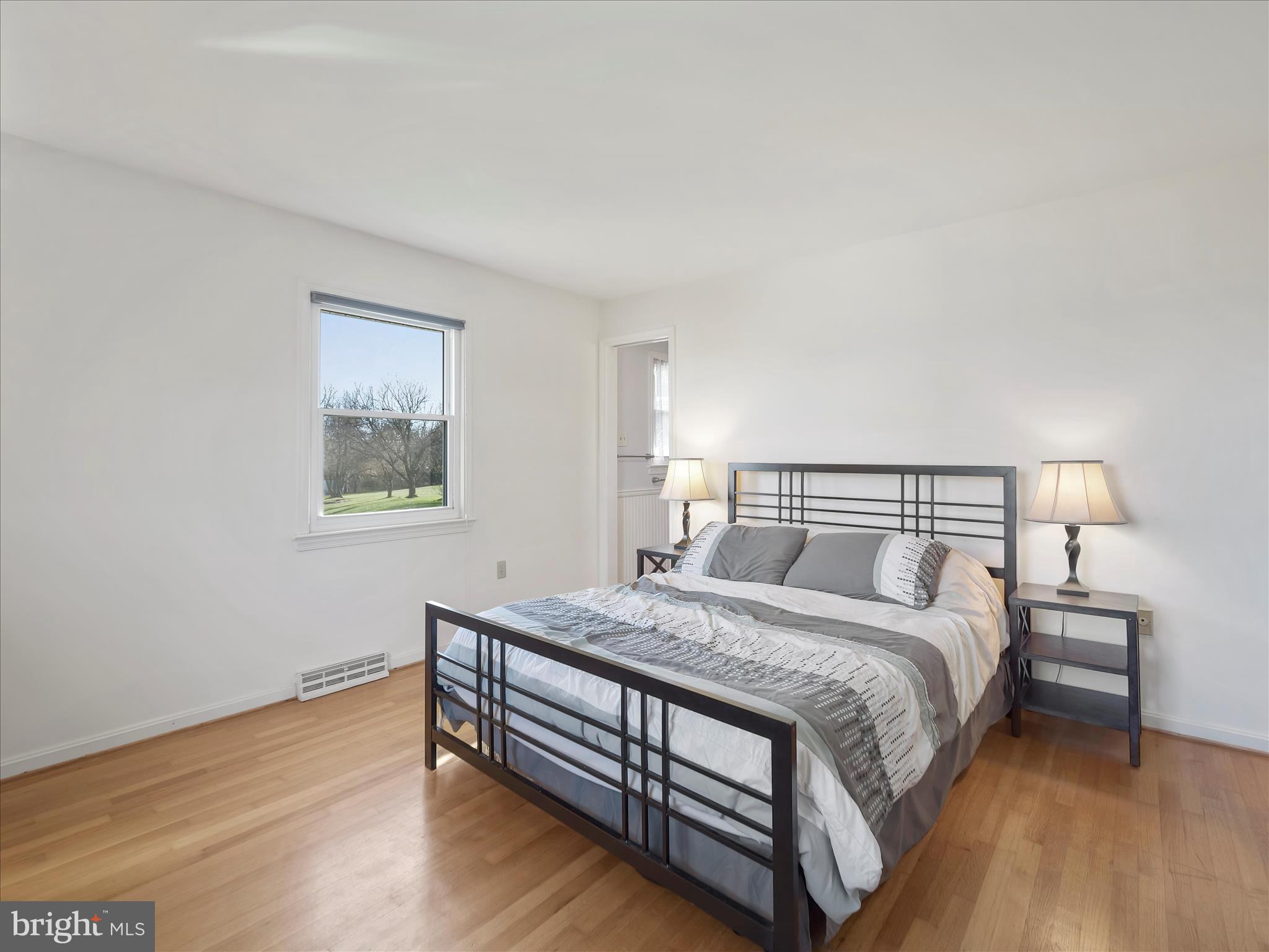 6527 Morningside Court Middletown, MD 21769 - Photo 30 of 42 a bedroom with a bed and a night stand