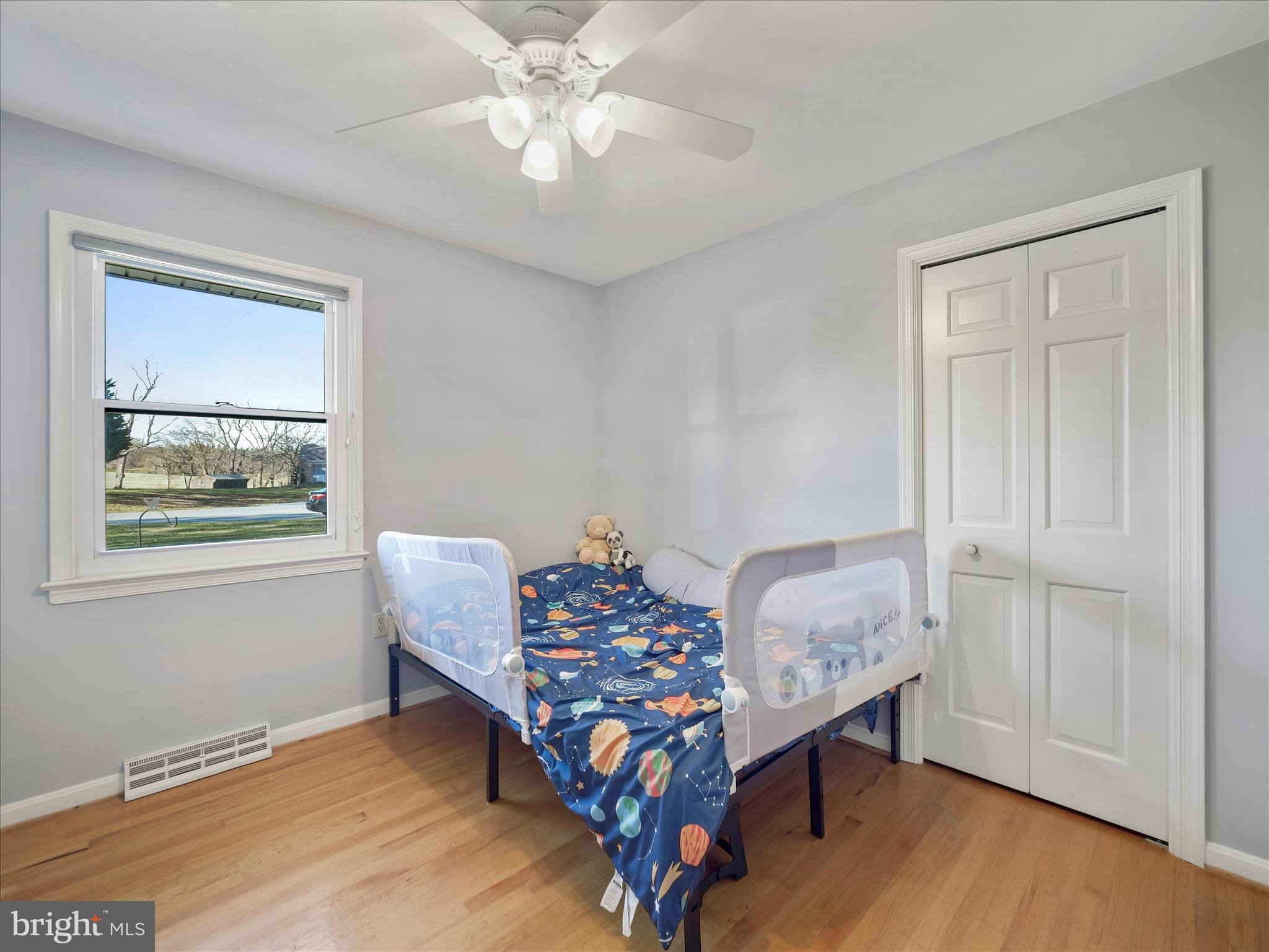 6527 Morningside Court Middletown, MD 21769 - Photo 35 of 42 a room with chandelier fan and wooden floor