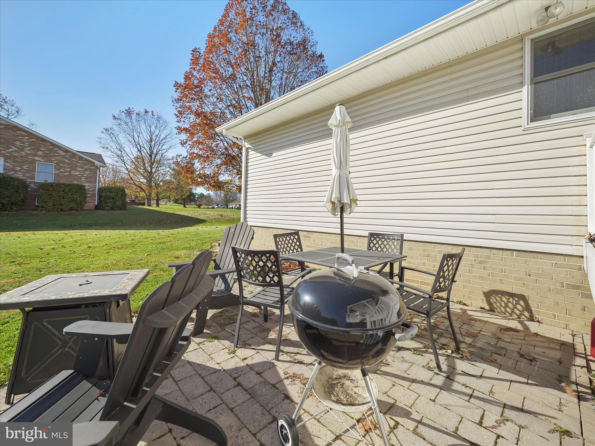6527 Morningside Court Middletown, MD 21769 - Photo 8 of 42 a view of a patio with table and chairs potted plants and a barbeque