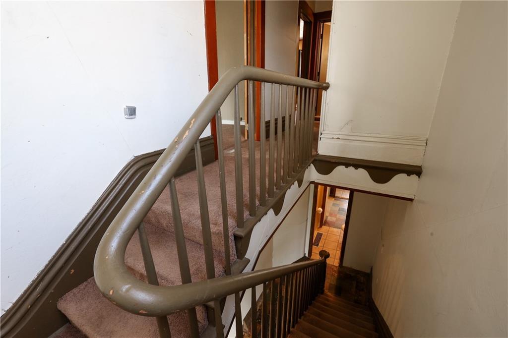 1845 Ley Street Pittsburgh, PA 15212 - Photo 15 of 41 a view of staircase with wooden floor and white walls