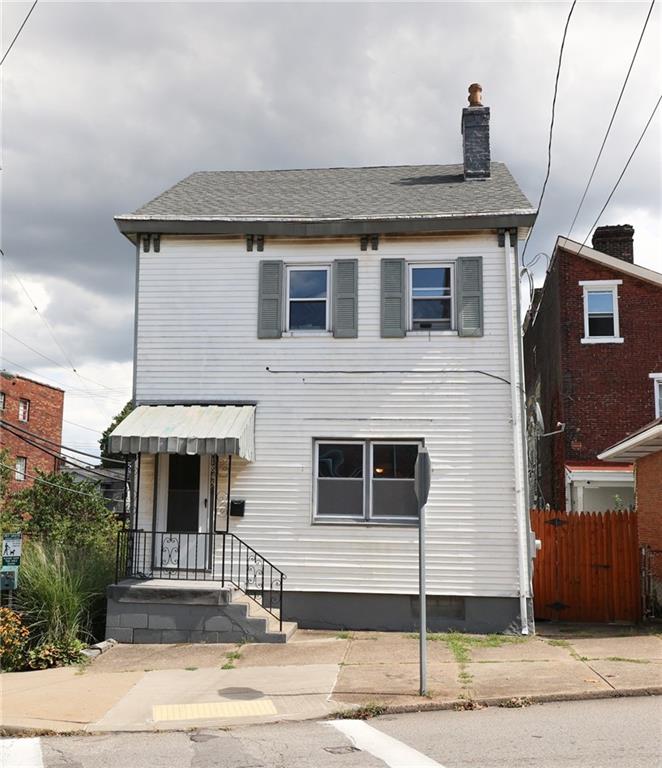 1845 Ley Street Pittsburgh, PA 15212 - Photo 2 of 41 a front view of a house with a garage