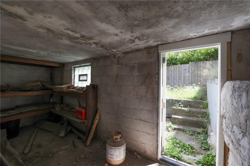 1845 Ley Street Pittsburgh, PA 15212 - Photo 27 of 41 a bathroom with a toilet and a shower curtain