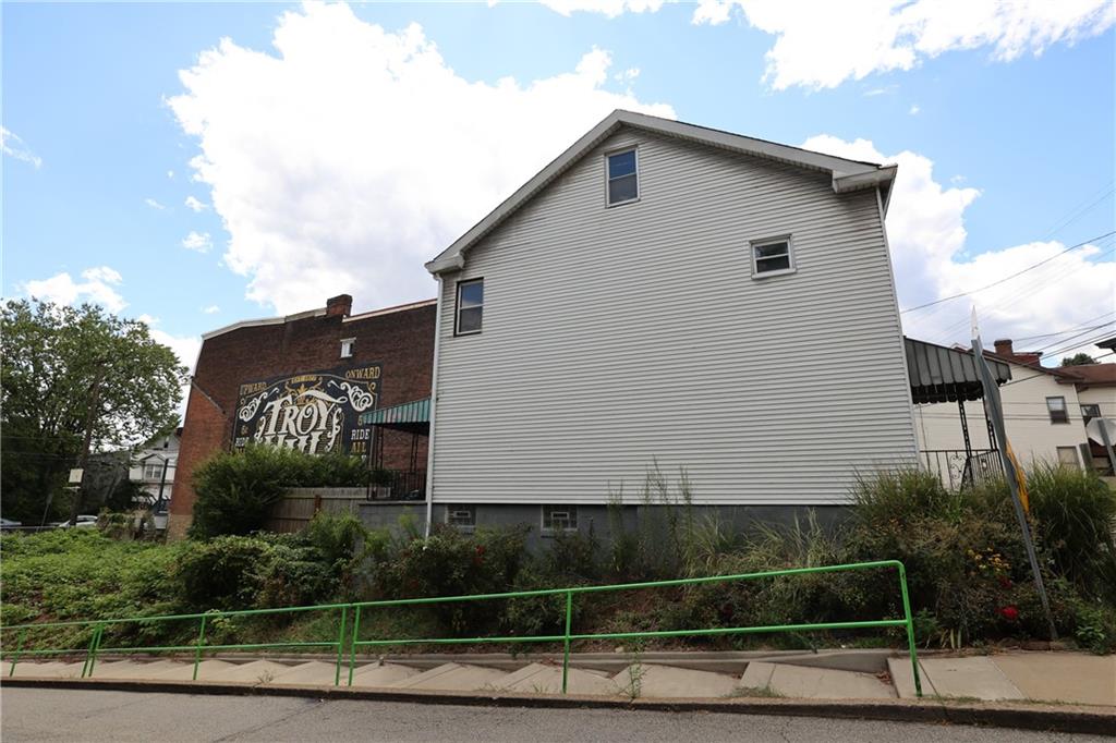 1845 Ley Street Pittsburgh, PA 15212 - Photo 4 of 41 a front view of a house with a garden