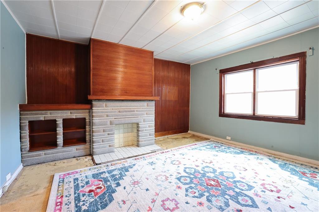 1845 Ley Street Pittsburgh, PA 15212 - Photo 5 of 41 a bedroom with a bed and a fireplace