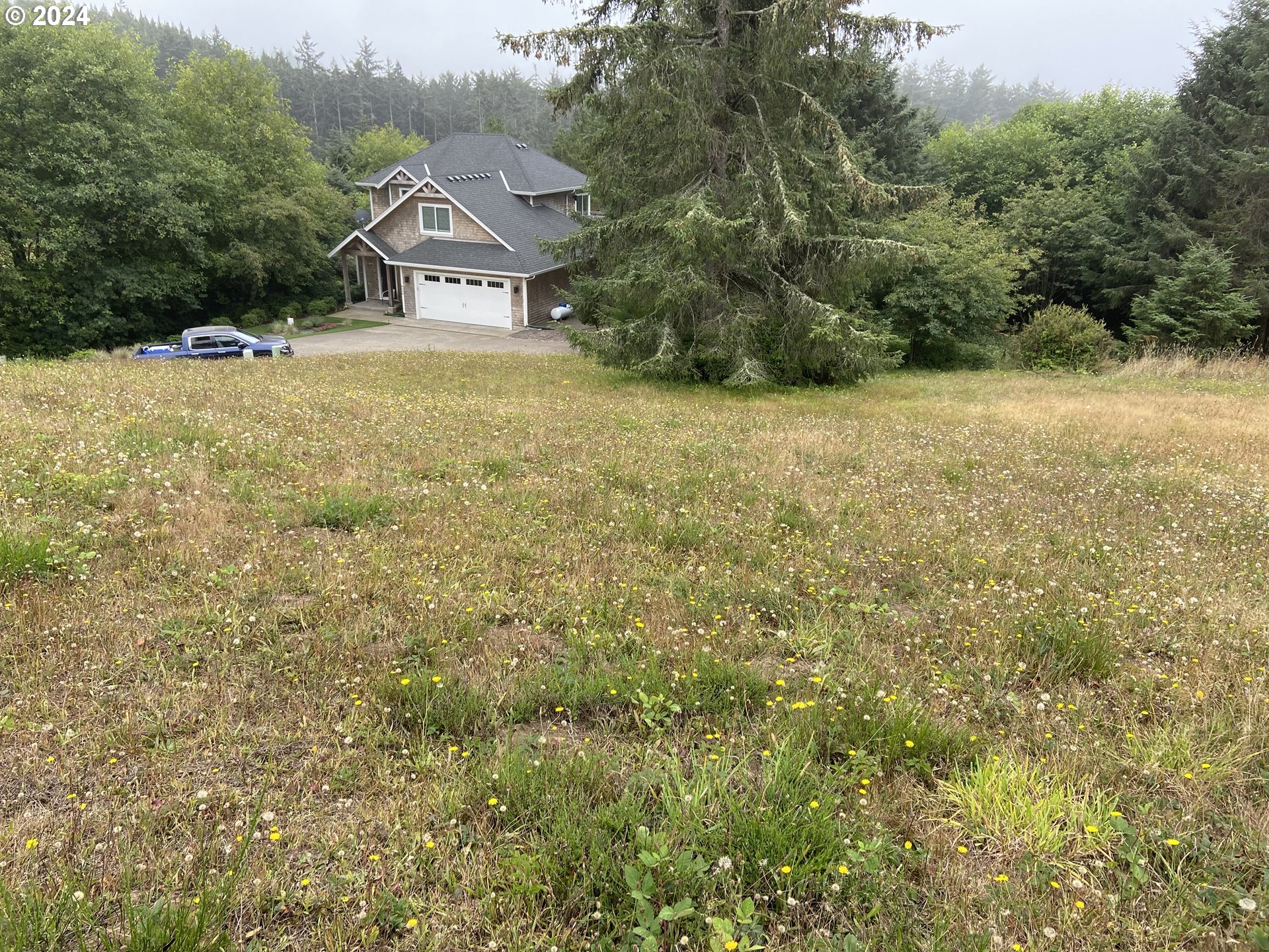 55 Meadow View Cloverdale, OR 97112 - Photo 2 of 2 a view of a house with a yard