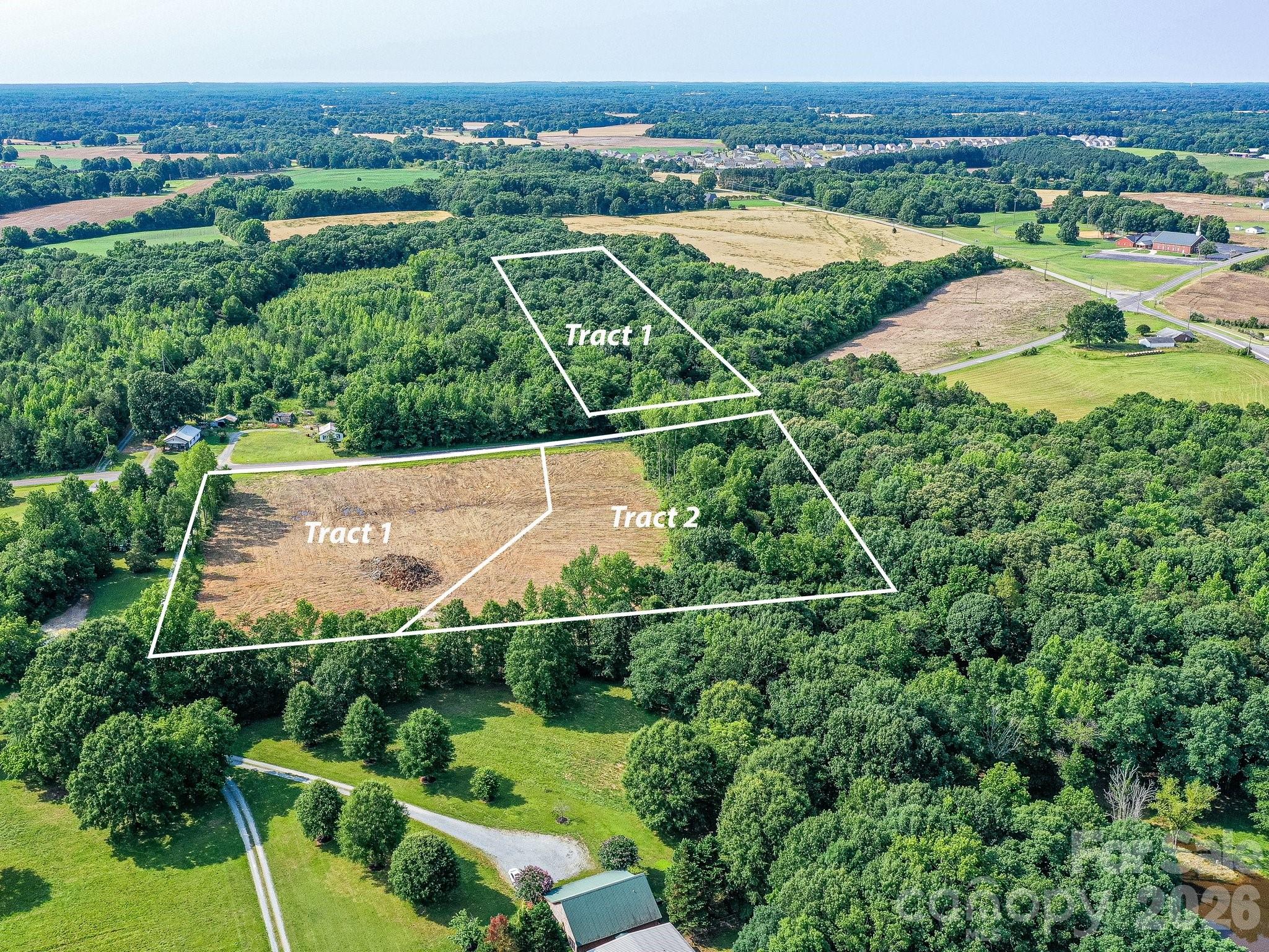1114 East Unionville-Indian Trail Road, Unit 2 Monroe, NC 28110 - Photo 2 of 3 an aerial view of residential houses with outdoor space and river