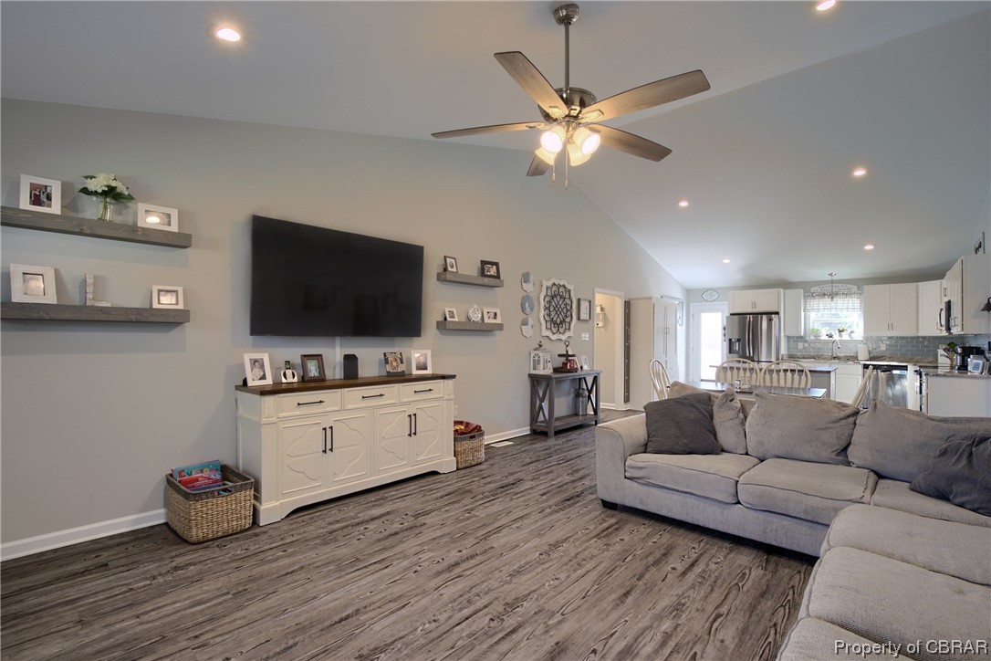 4944 Chestnut Fork Road Gloucester, VA 23061 - Photo 4 of 32 Living room featuring dark hardwood / wood-style flooring, ceiling fan, and high vaulted ceiling
