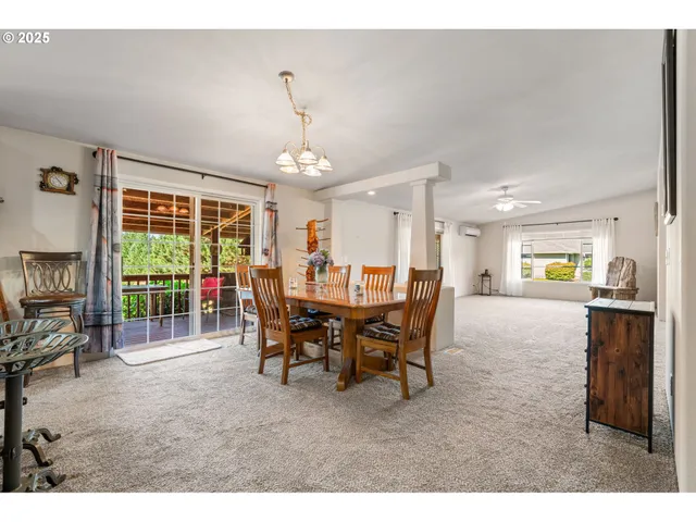 a view of a dining room with furniture window and outside view
