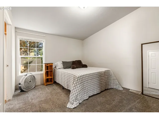 a bedroom with a bed and closet