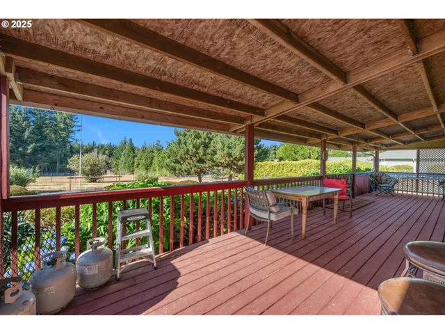 a view of a patio with wooden floor