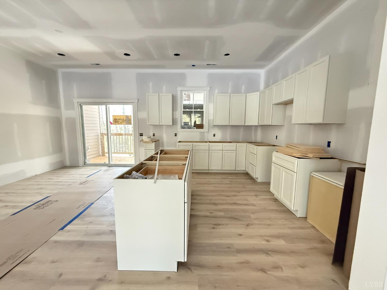 116 Blue Sky Court Monroe, VA 24574 - Photo 15 of 44 a large kitchen with a stove a sink a refrigerator and cabinets