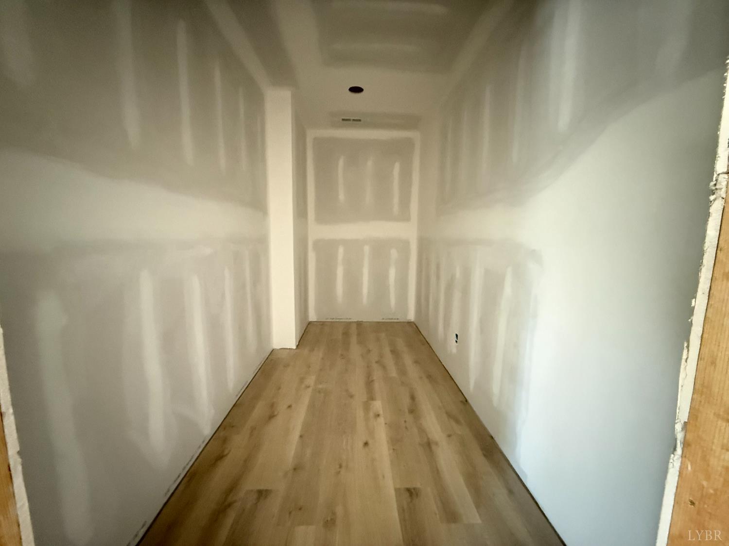 116 Blue Sky Court Monroe, VA 24574 - Photo 22 of 44 a view of a hallway with wooden floor