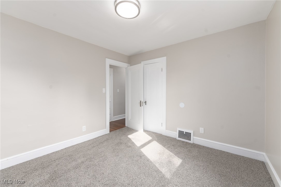 3459 Helen Road Shaker Heights, OH 44122 - Photo 20 of 29 Carpeted empty room with baseboards and visible vents