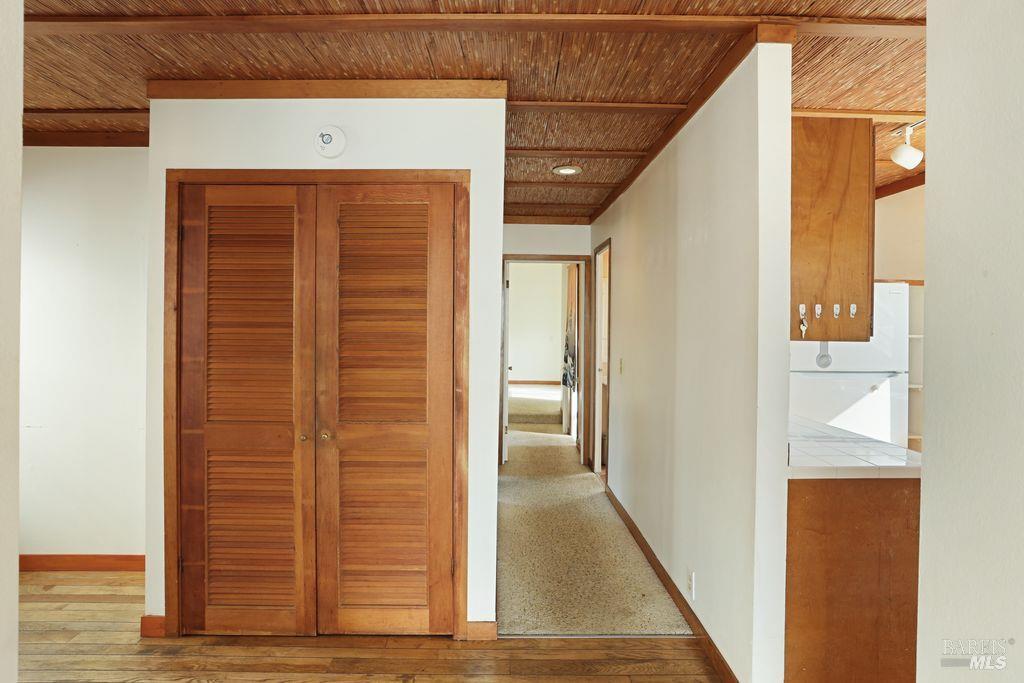 34 Sandy Beach Road Vallejo, CA 94590 - Photo 30 of 63 a view of a hallway with wooden floor and staircase