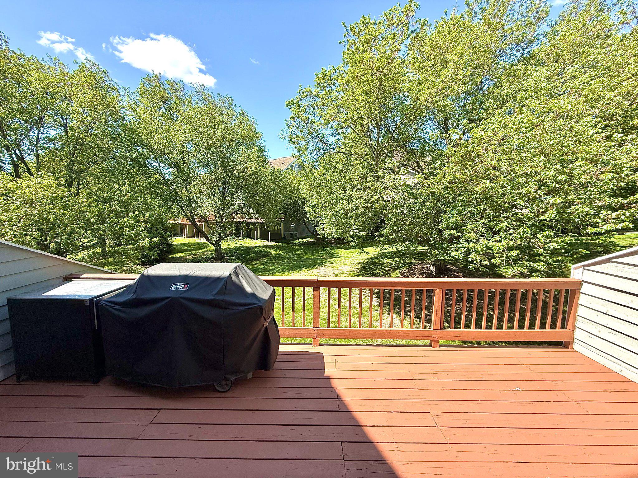 5081 Columbia Road, Unit 17 105 Columbia, MD 21044 - Photo 17 of 40 Serene deck with lush green backdrop.