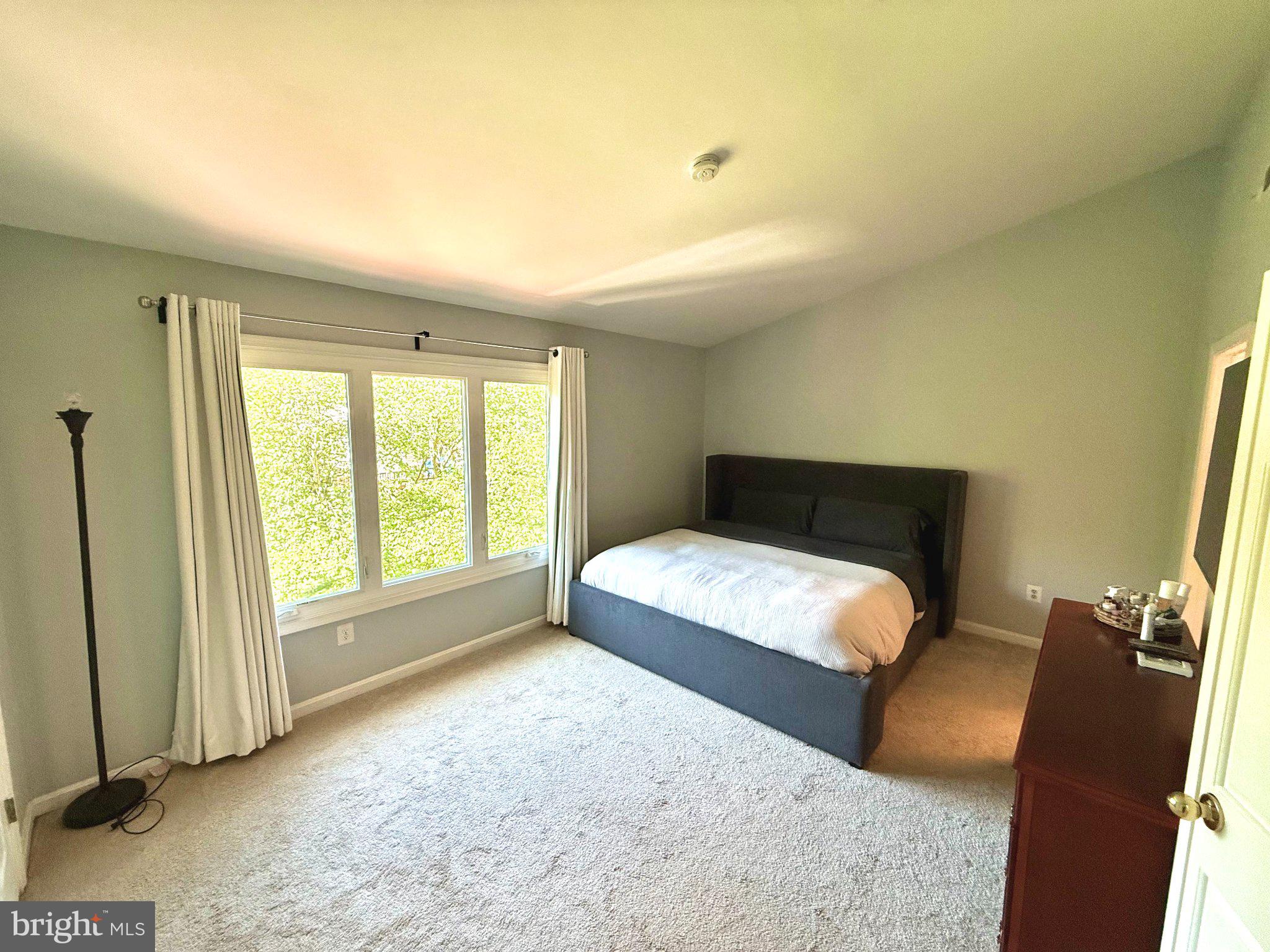 5081 Columbia Road, Unit 17 105 Columbia, MD 21044 - Photo 20 of 40 Serene bedroom with natural light.