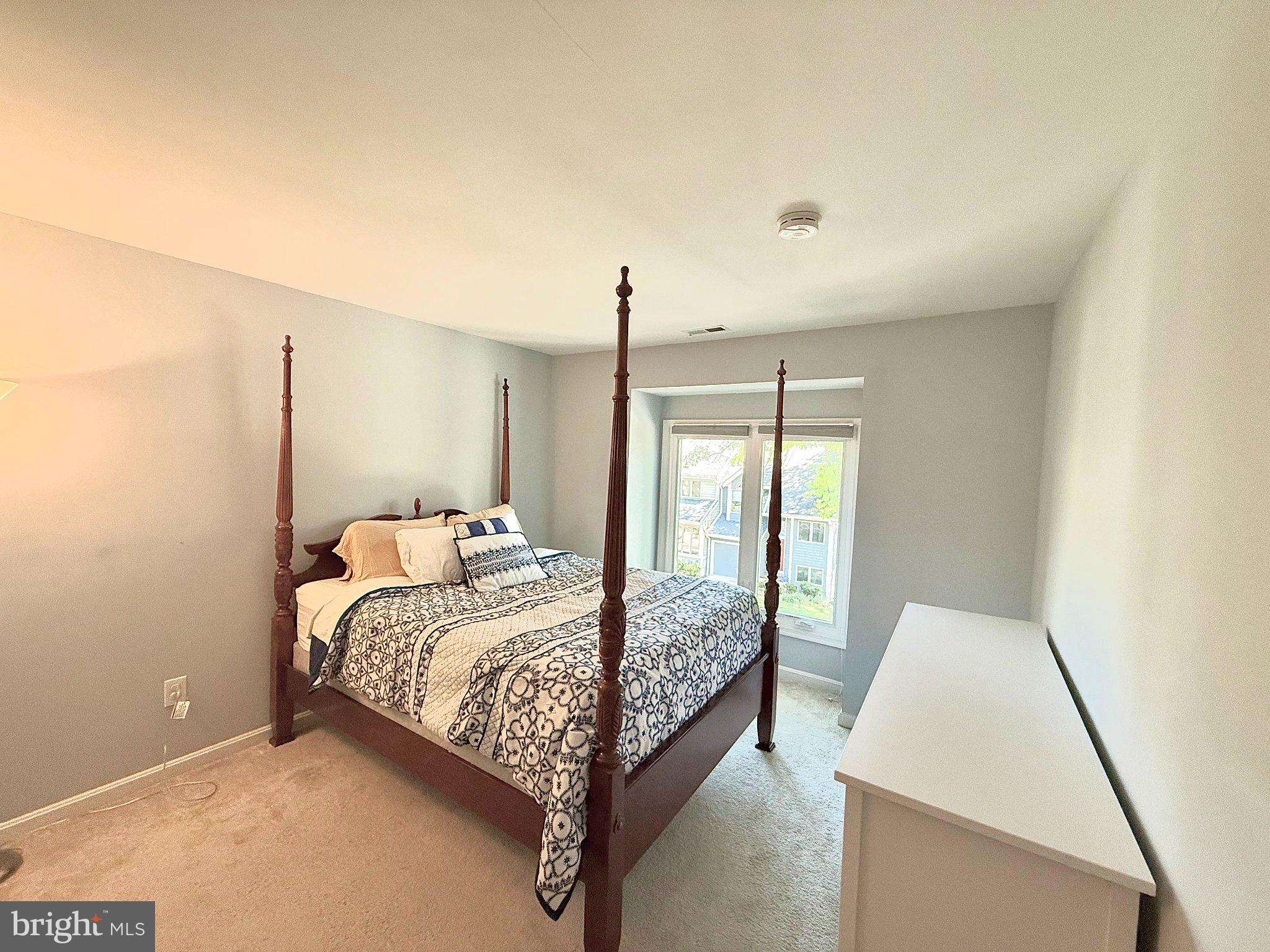 5081 Columbia Road, Unit 17 105 Columbia, MD 21044 - Photo 25 of 40 Serene bedroom with natural light.