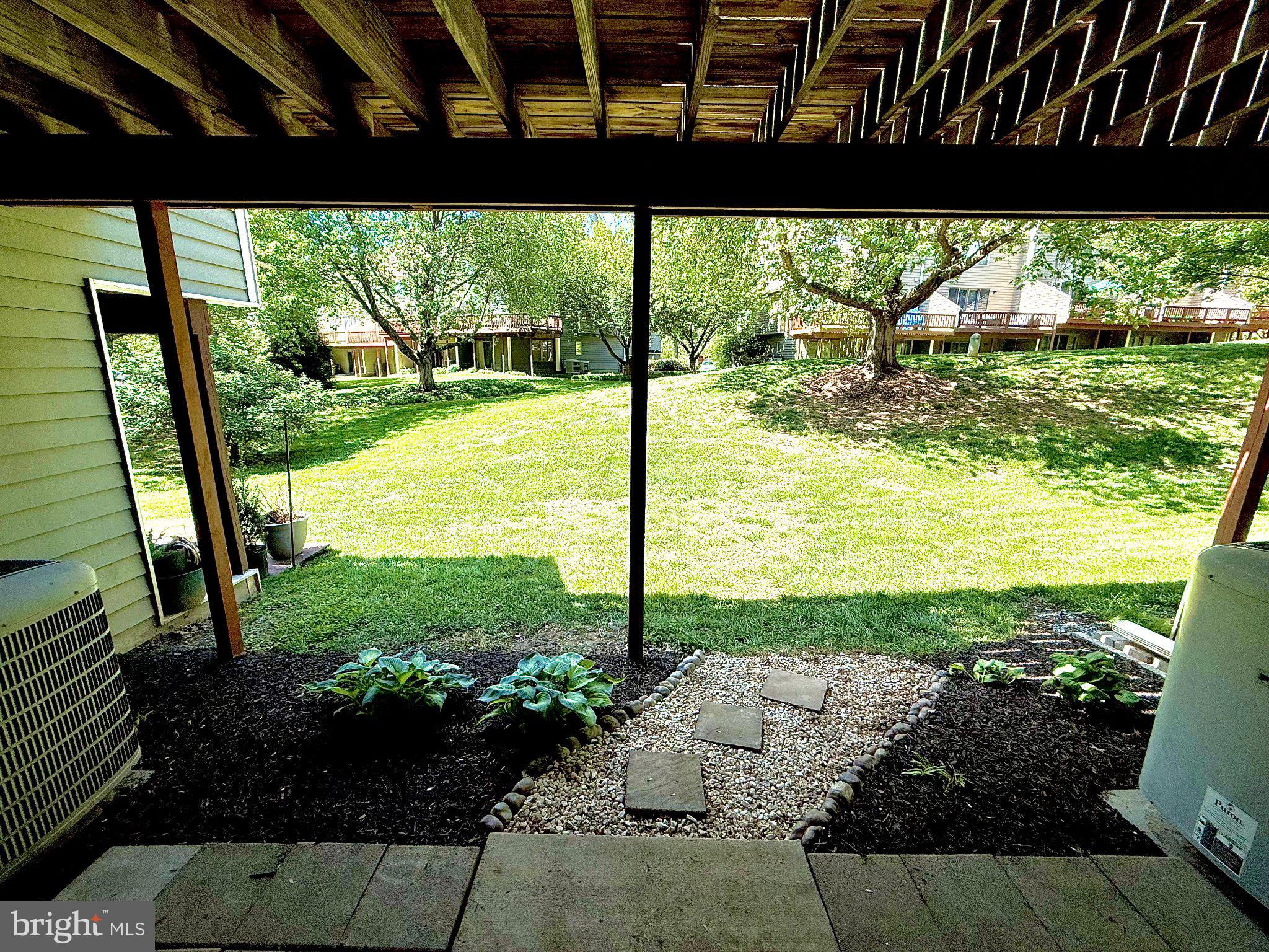 5081 Columbia Road, Unit 17 105 Columbia, MD 21044 - Photo 38 of 40 Serene backyard view with lush greenery.
