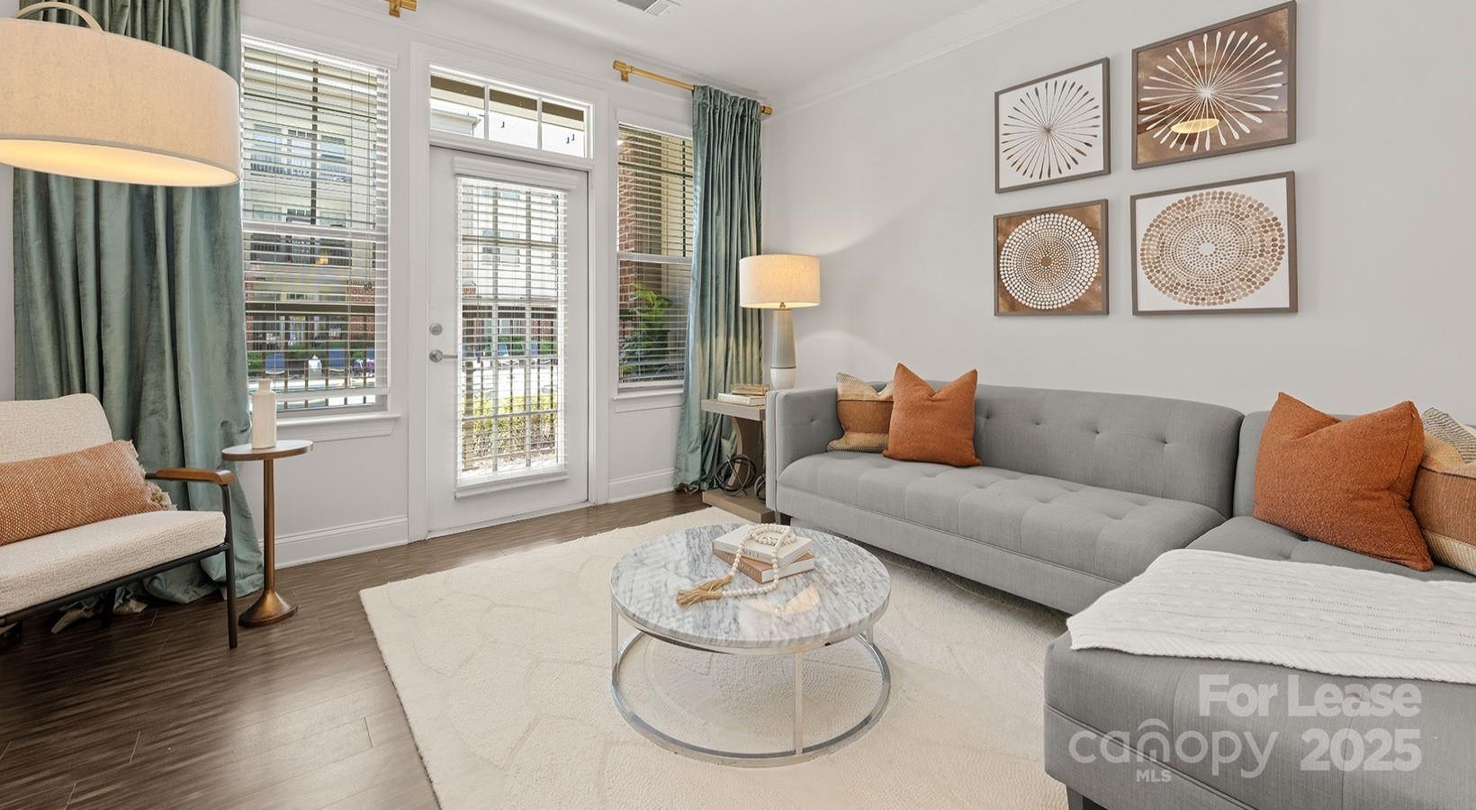 10624 Parrish Street, Unit B1 Matthews, NC 28105 - Photo 41 of 42 a living room with furniture and a large window