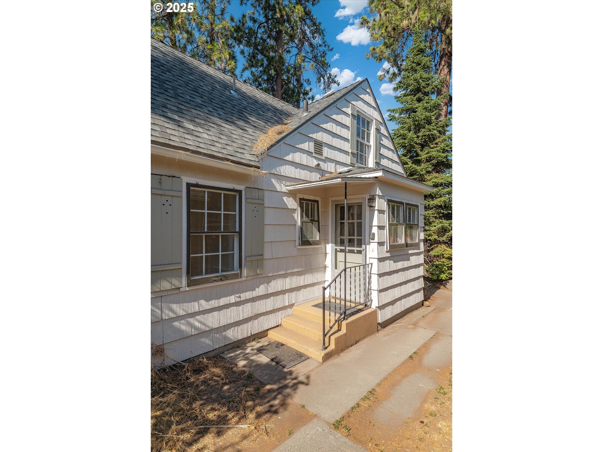 1118 East 28th Avenue Spokane, WA 99203 - Photo 12 of 48 a view of a house with a balcony and wooden floor