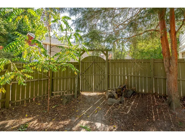 a backyard of a house with lots of green space