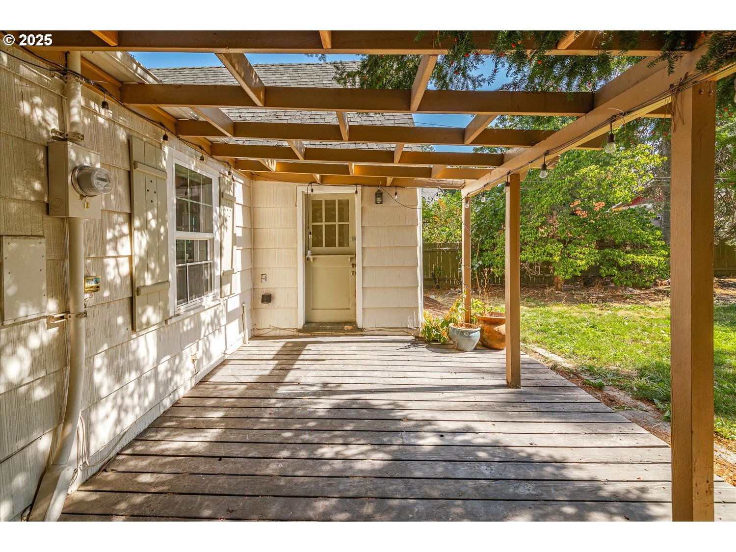 1118 East 28th Avenue Spokane, WA 99203 - Photo 30 of 48 a view of a room with wooden floor and windows
