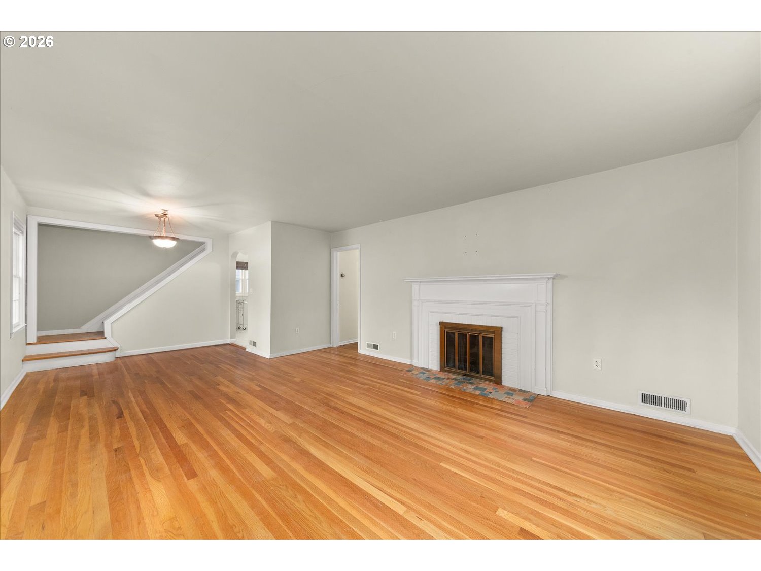 1118 East 28th Avenue Spokane, WA 99203 - Photo 34 of 48 a bedroom with a bed and a fireplace