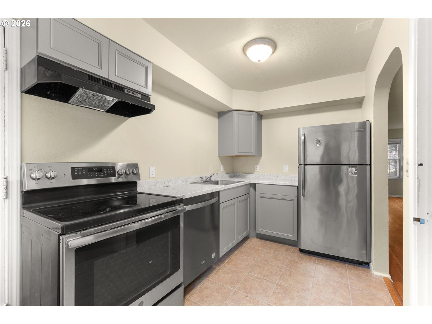 1118 East 28th Avenue Spokane, WA 99203 - Photo 44 of 48 a kitchen with a refrigerator and a sink