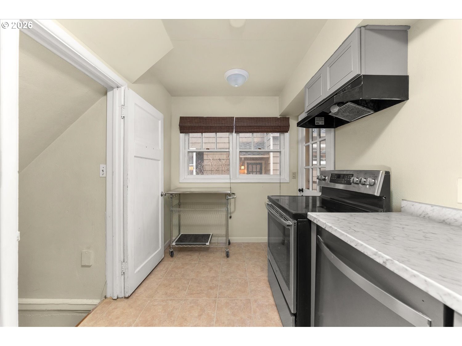 1118 East 28th Avenue Spokane, WA 99203 - Photo 45 of 48 a kitchen that has a sink a stove and a microwave
