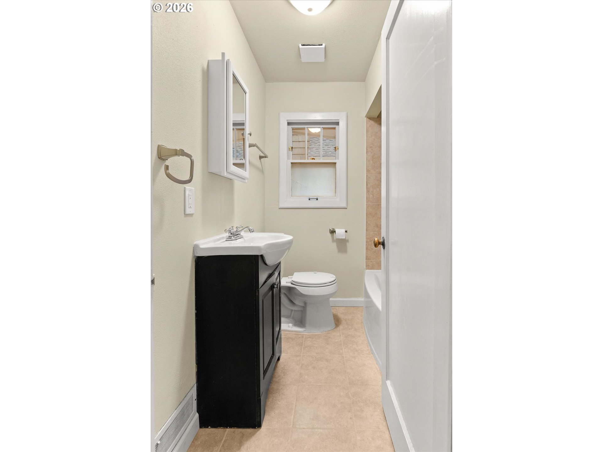 1118 East 28th Avenue Spokane, WA 99203 - Photo 47 of 48 a bathroom with a sink and a toilet