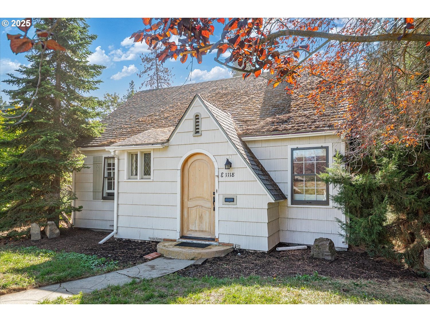 1118 East 28th Avenue Spokane, WA 99203 - Photo 9 of 48 a view of a white house with a yard