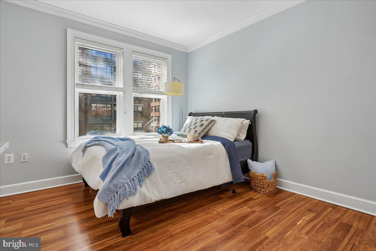 1121 24th Street Northwest, Unit 309 Washington, DC 20037 - Photo 15 of 20 a bedroom with a bed and a window