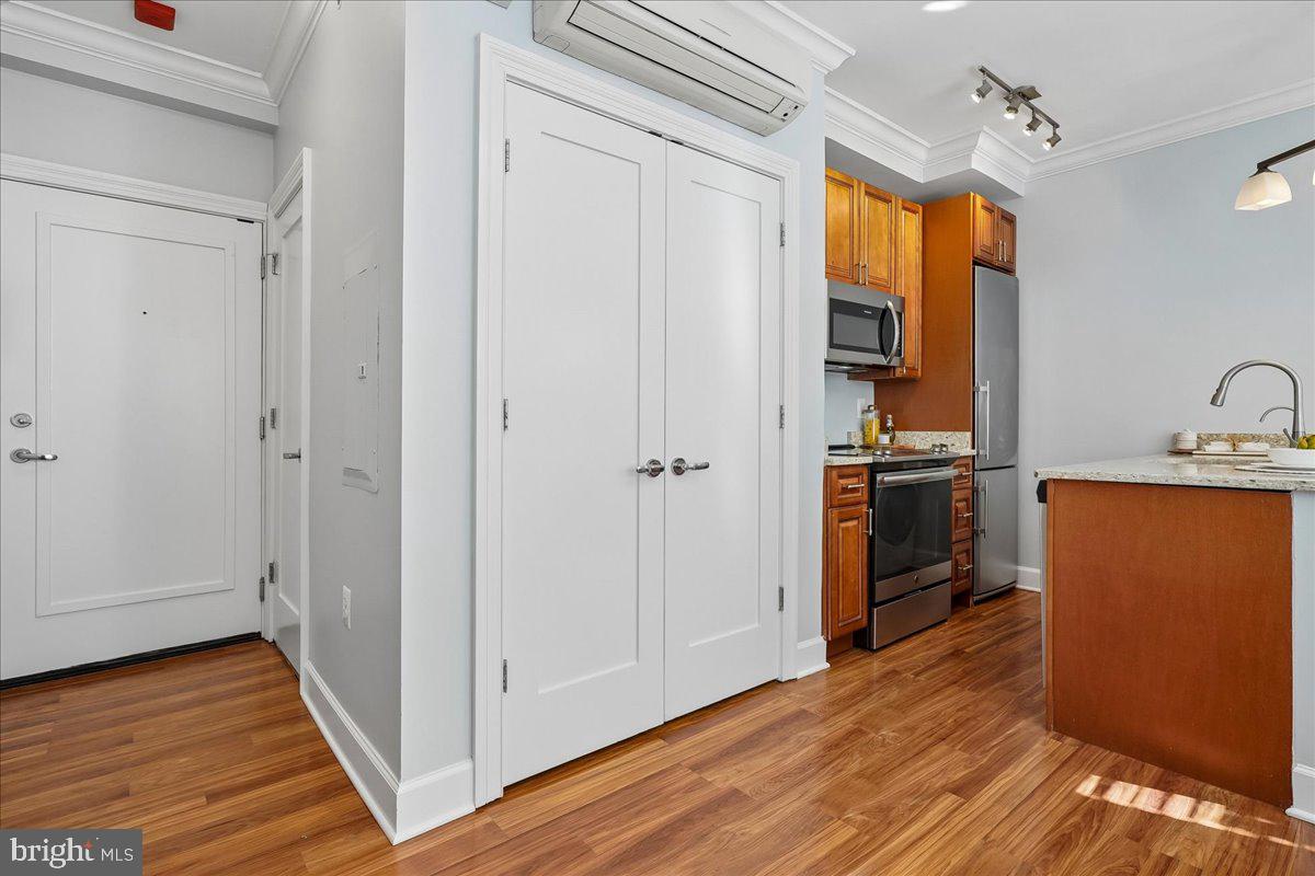 1121 24th Street Northwest, Unit 309 Washington, DC 20037 - Photo 6 of 20 a kitchen with stainless steel appliances granite countertop a refrigerator and a sink