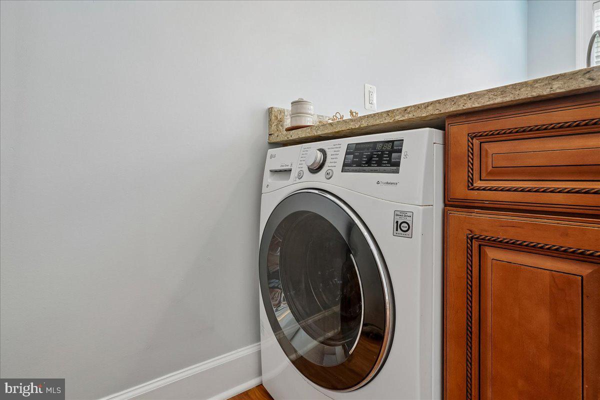 1121 24th Street Northwest, Unit 309 Washington, DC 20037 - Photo 9 of 20 a utility room with dryer and washer