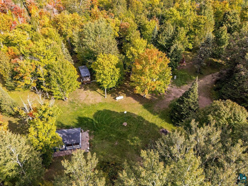 1159 Wales Road Two Harbors, MN 55616 - Photo 22 of 29 Expansive wooded lot featuring a central grassy clearing and mature deciduous trees