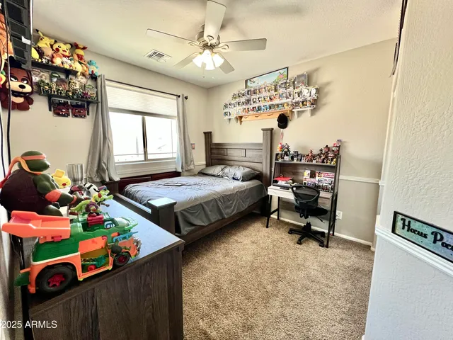 a bedroom with bed and window
