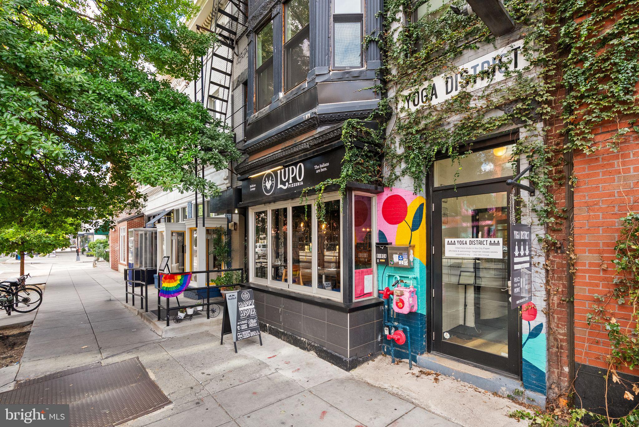 1335 Harvard Street Northwest, Unit 1 Washington, DC 20009 - Photo 27 of 29 Charming street scene with vibrant shops.