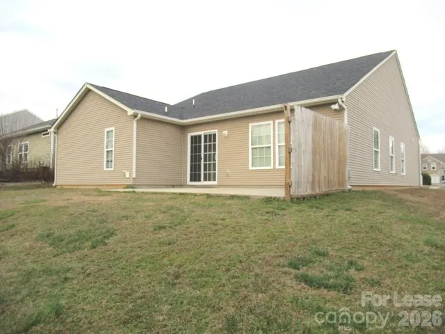 a house view with a backyard space