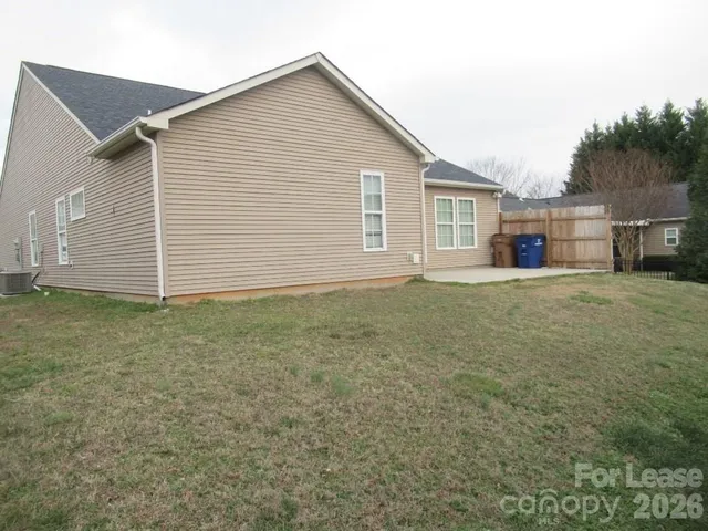 a view of a house with a yard and garage