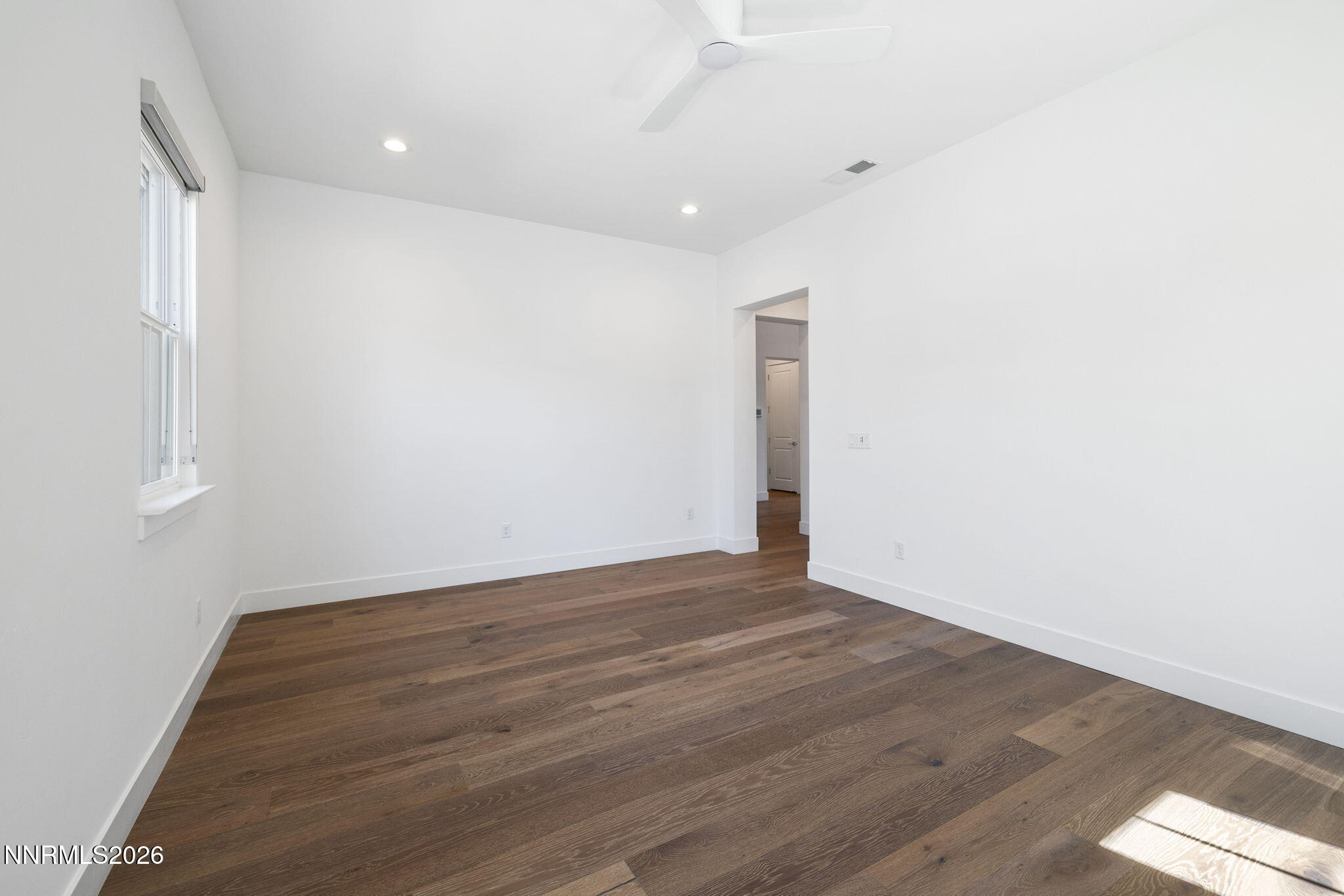 5406 Side Saddle Trail Reno, NV 89511 - Photo 13 of 39 a view of an empty room with wooden floor