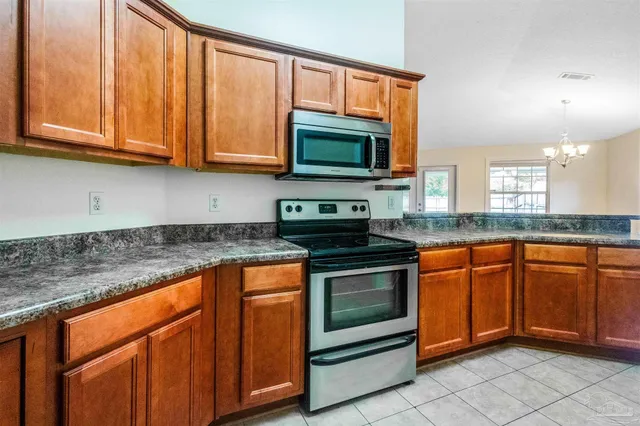 a view of a backyard with potted plants