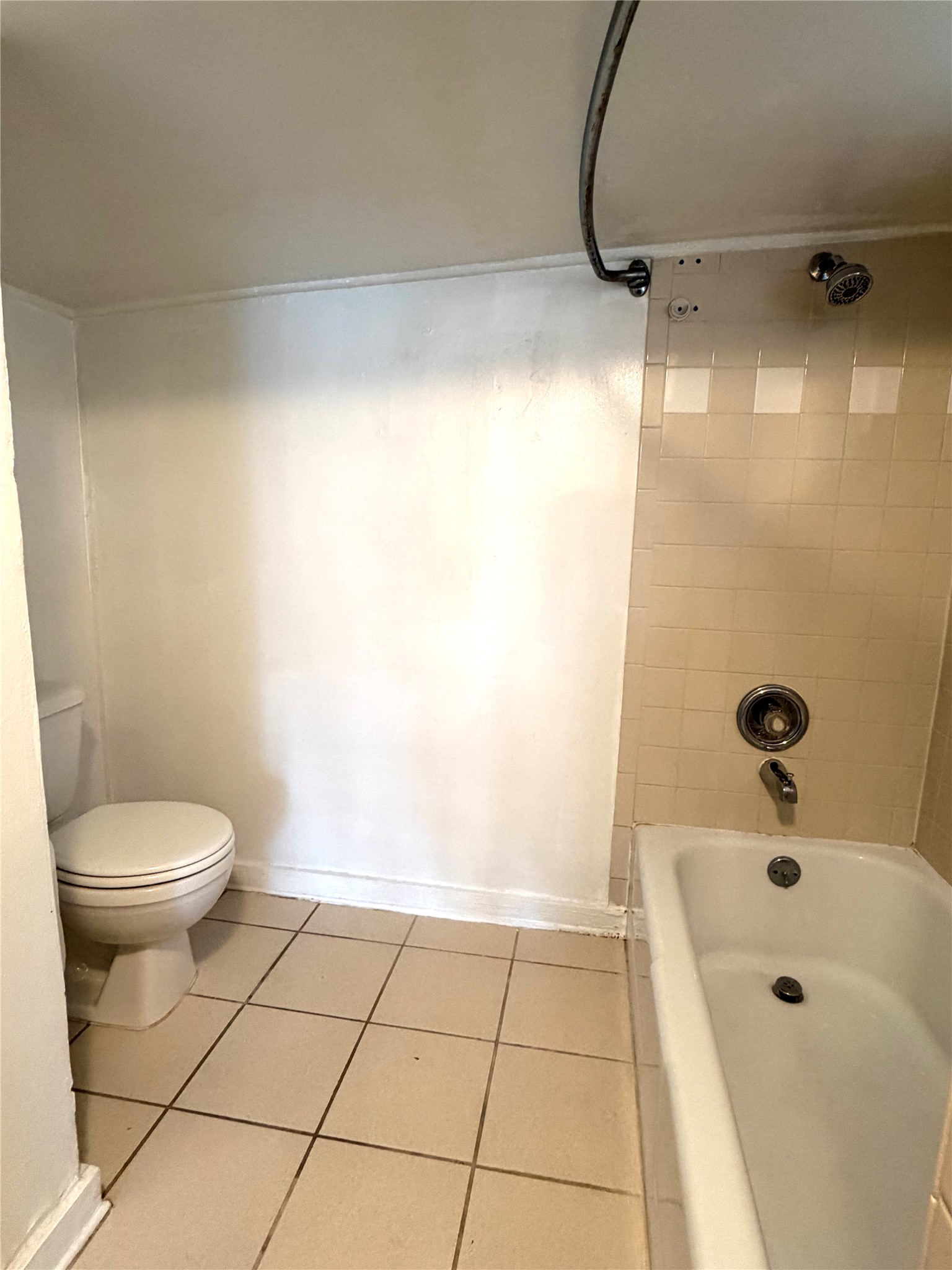 808 Edgecliff Terrace, Unit C Austin, TX 78704 - Photo 8 of 12 Bathroom featuring tile patterned flooring and tub / shower combination