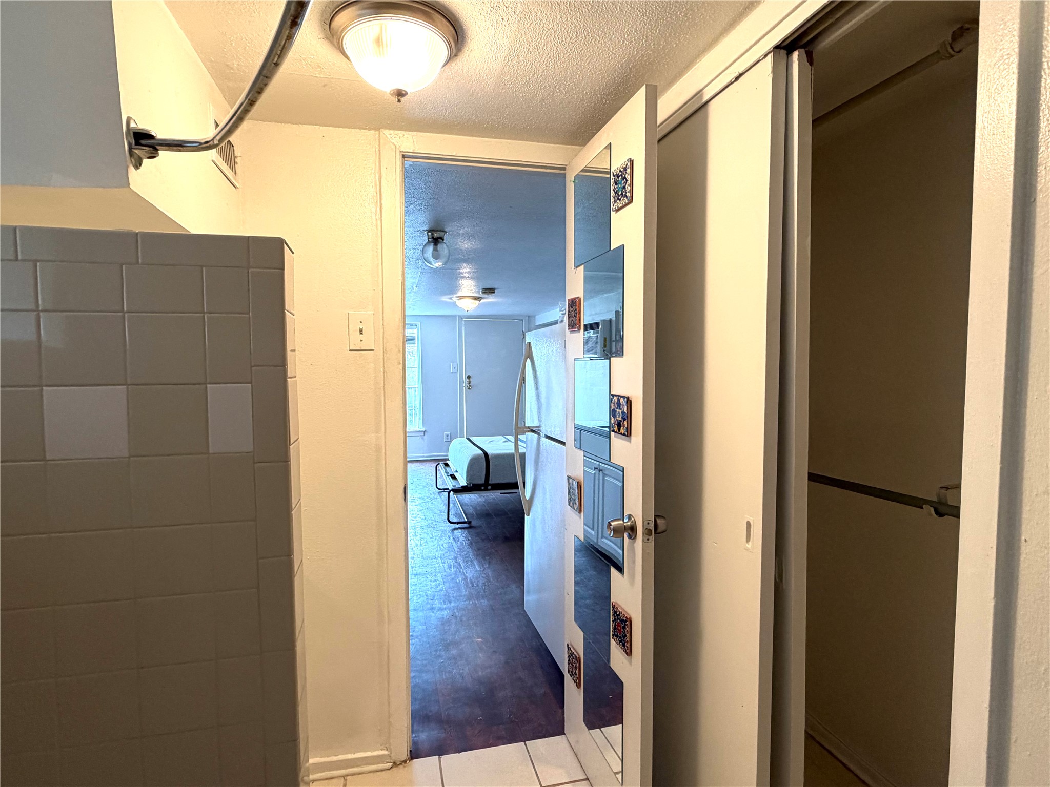 808 Edgecliff Terrace, Unit C Austin, TX 78704 - Photo 9 of 12 Hallway with a textured ceiling